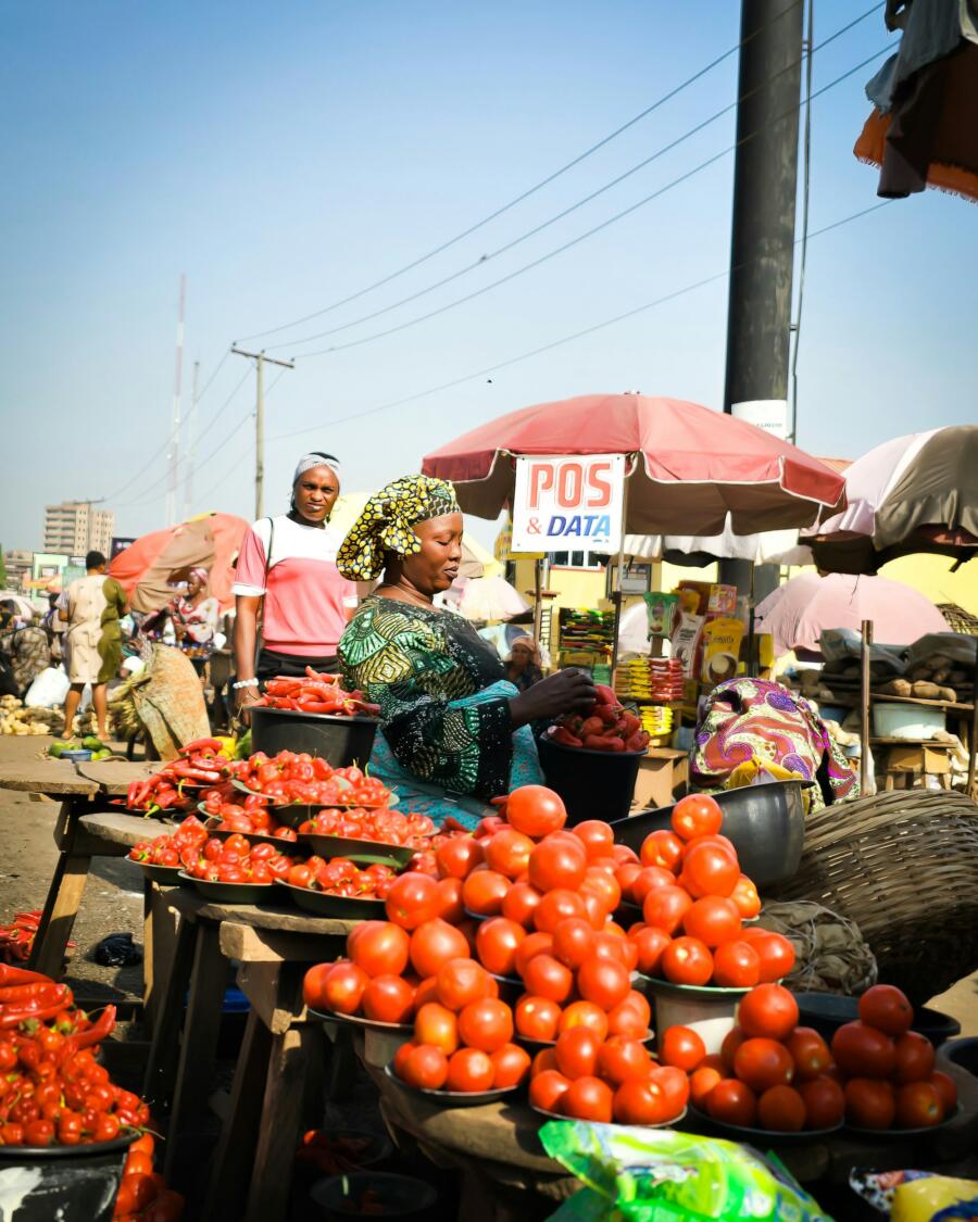 Fresh produce trader at an African market, illustrating agriculture and food value chains